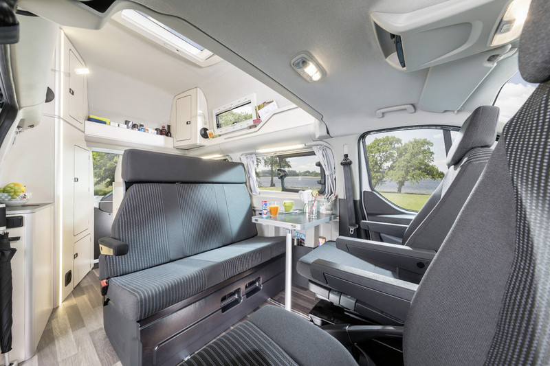 Illustration for article titled This Ingeniously Packaged Camper Packs Four People In A Tiny Van